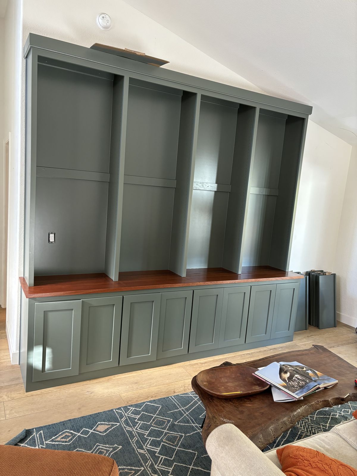 Stained oak kitchen island with a black countertop in Los Olivos, CA