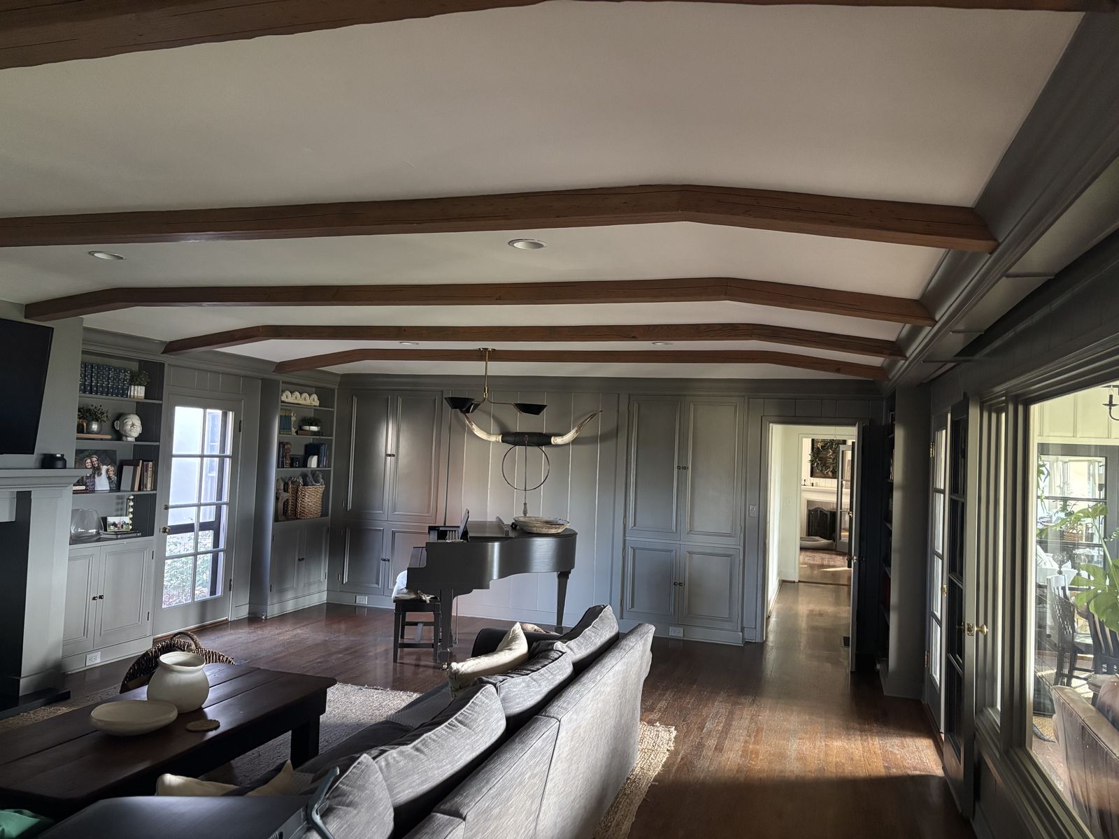 Gray-painted living room with stained wood ceiling beams in Santa Ynez, CA
